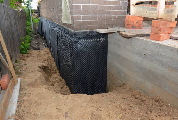 Happy homeowners after waterproofing job in Saint Cloud